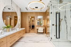 Luxurious modern bathroom with wooden and marble finishes.